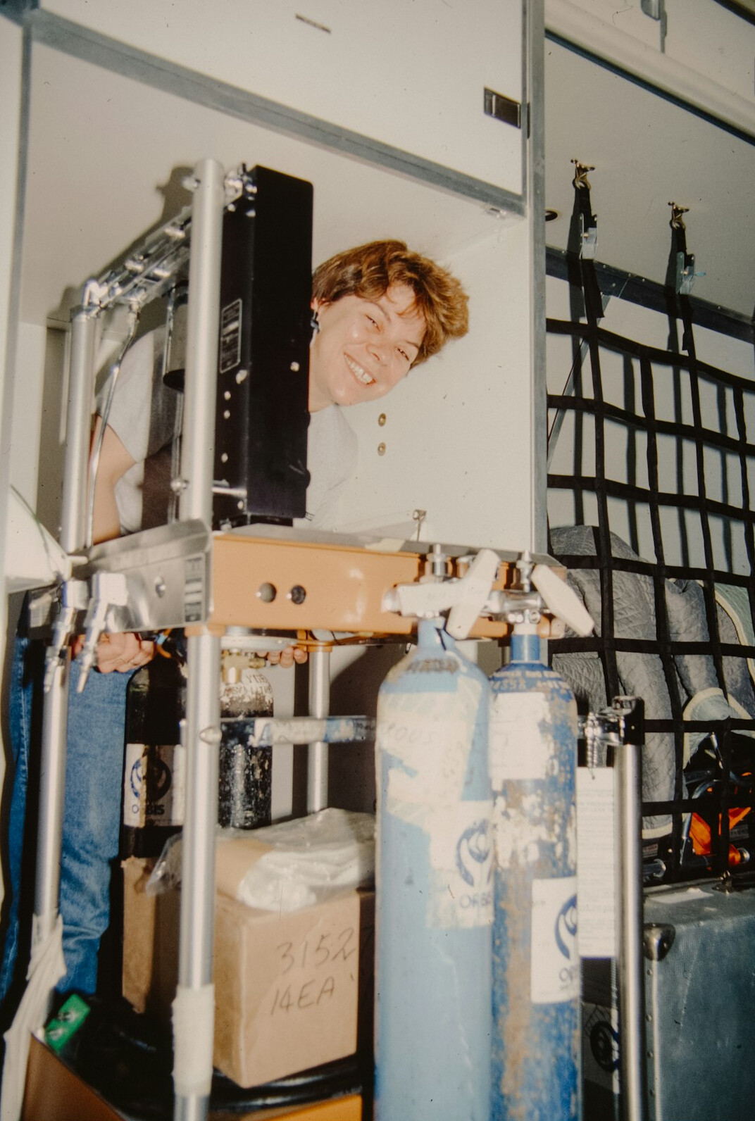 Engineer monitoring live signal feeds on a rack of screens